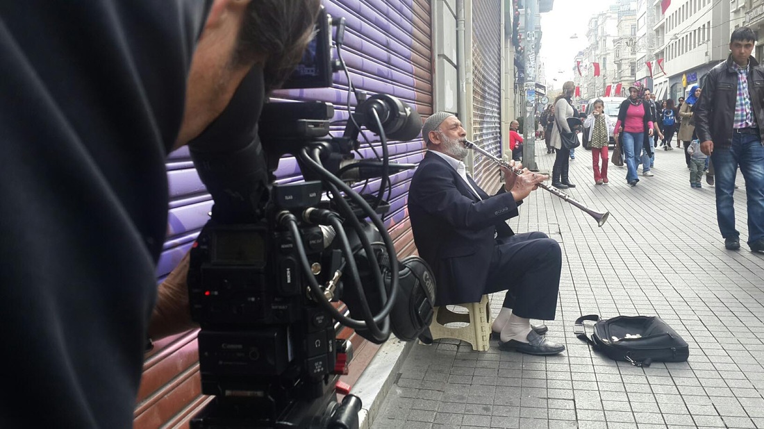 filming old street musician in istanbul